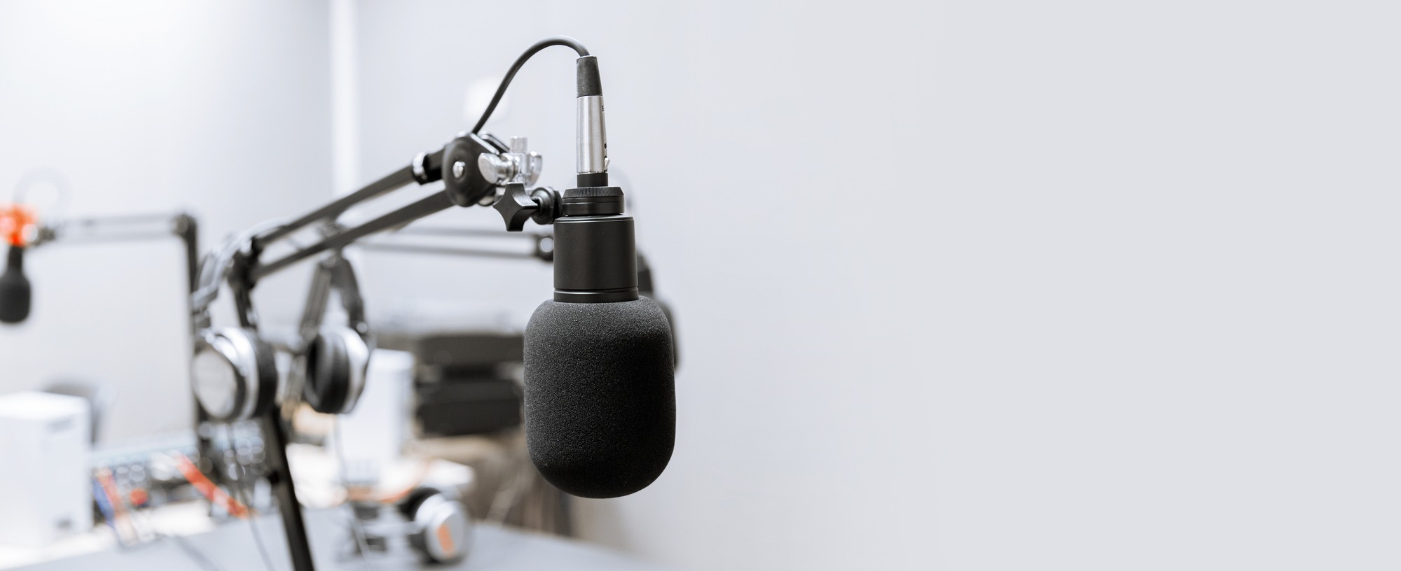 Technology and audio equipment concept - microphone at recording studio or radio station.